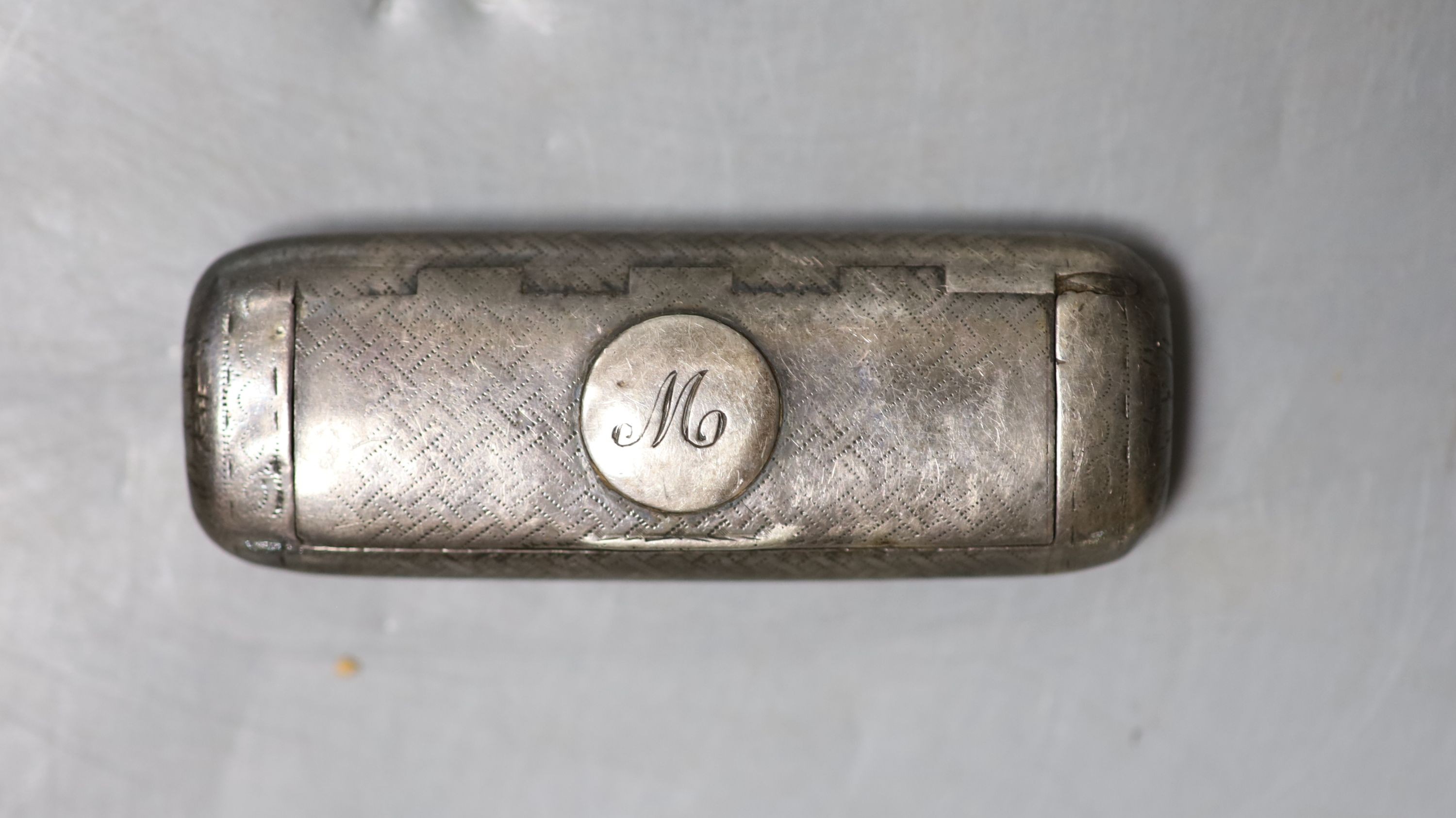 A George III engraved silver shaped rectangular vinaigrette?, London, 1806, no maker's mark or grille, 7cm (tired).